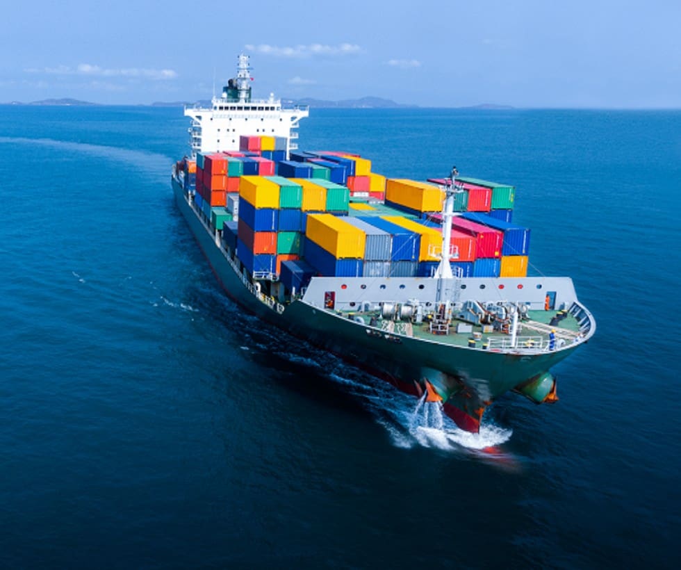 A large boat with many containers on it